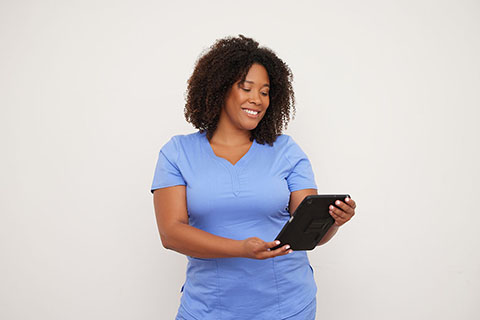 clinical employee looking at tablet device