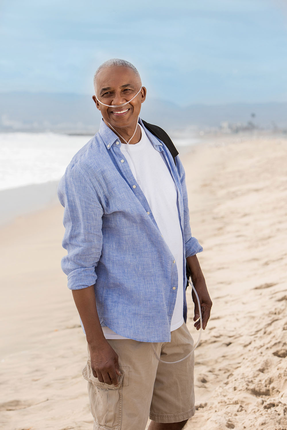 Oxygen Black Male Patient POC Standing on Beach Active Lifestyle