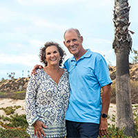 hp Lifestyle WhiteFemaleWhiteMaleCouple BeachPalmTreesSand LookingatCamera